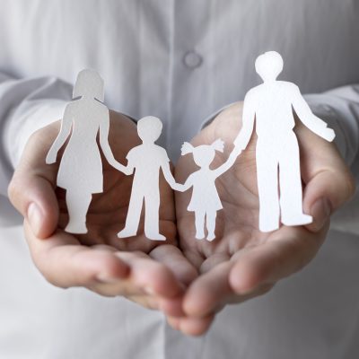 hands-holding-paper-people-close-up